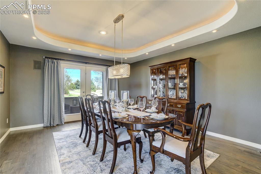 Image 24 of 50: A dedicated dining room offers a more refined setting for gathering, comple