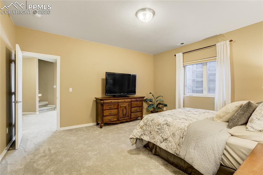 Image 45 of 50: A private lower-level retreat with walk-in closet and direct access to a fu