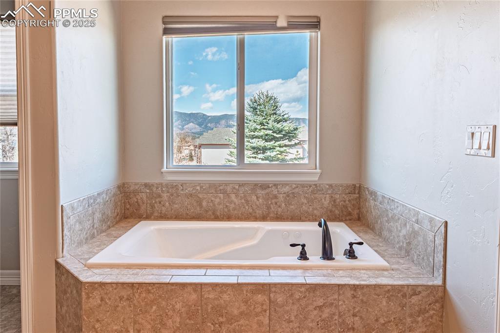 Image 14 of 36: Bathroom with a bath