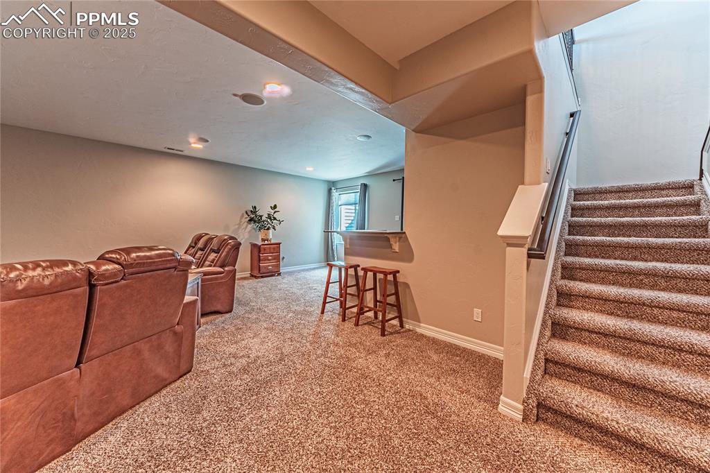 Image 20 of 36: Cinema with baseboards and carpet floors