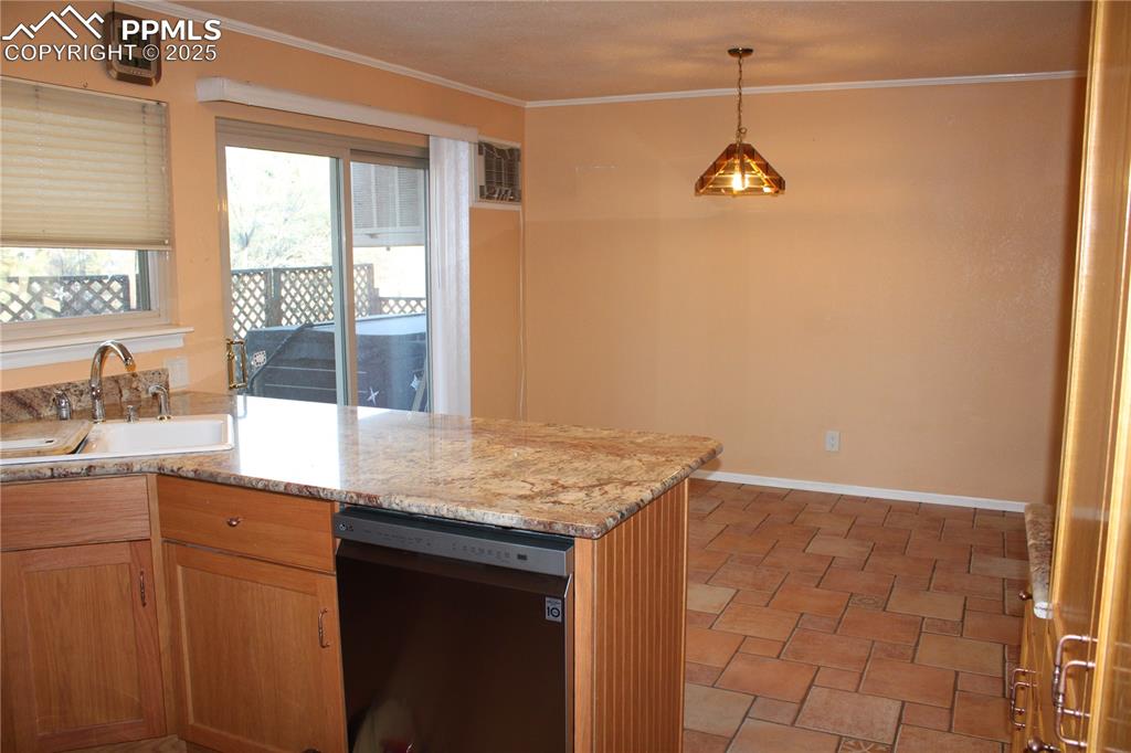 Image 20 of 48: Kitchen looking into dining area. 