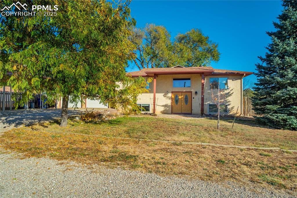 Image 39 of 48: View of front of property featuring stucco siding