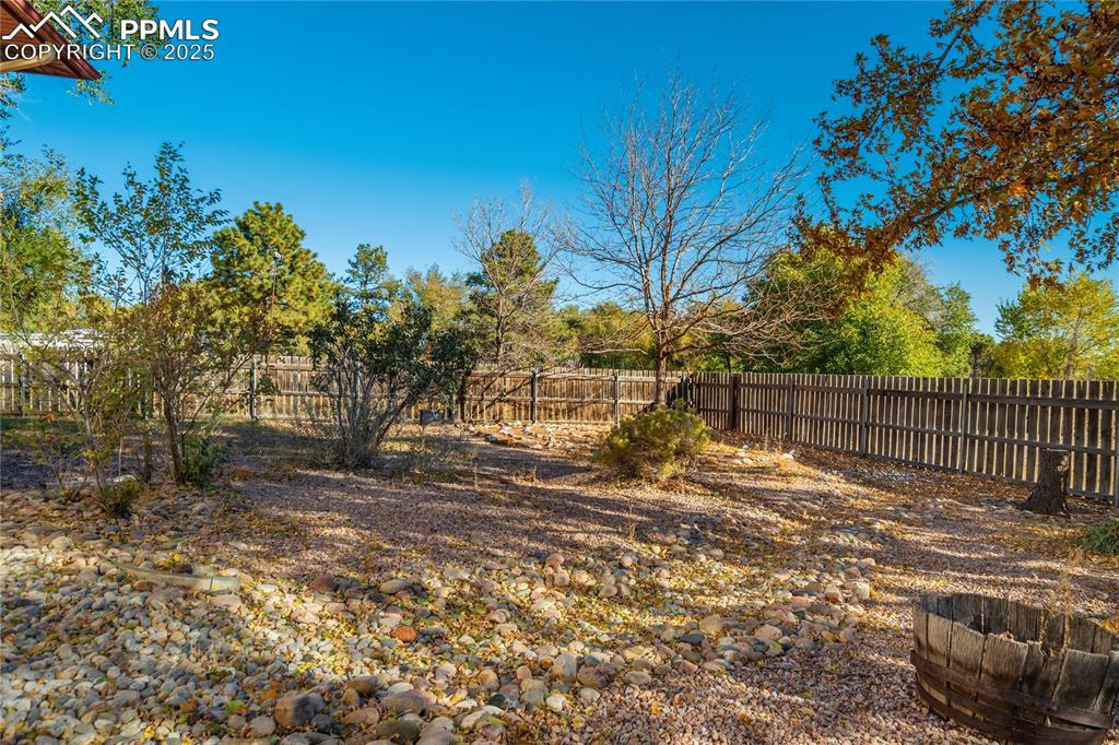 Image 43 of 48: View of fenced backyard