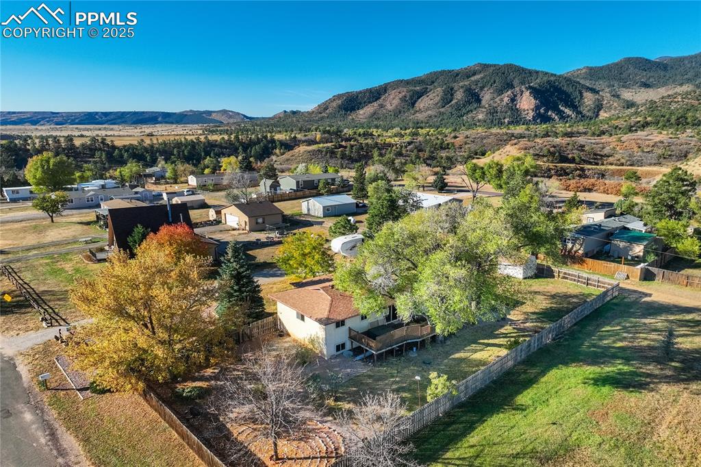Image 48 of 48: Aerial perspective of suburban area featuring mountains