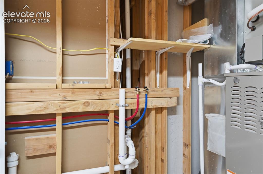 Image 45 of 50: Washer hookup. The dryer gas line was moved due to the new Central A/C. A d