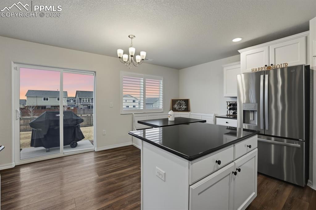 Image 11 of 38: large center island offers more storage and work space