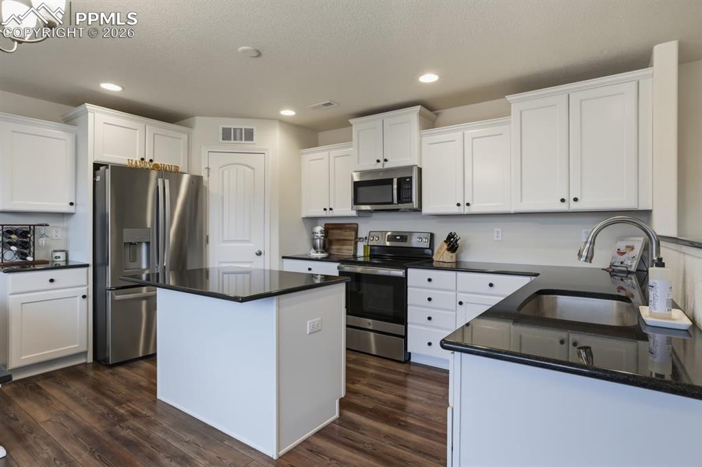 Image 14 of 38: granite countertops with lots of work and storage space