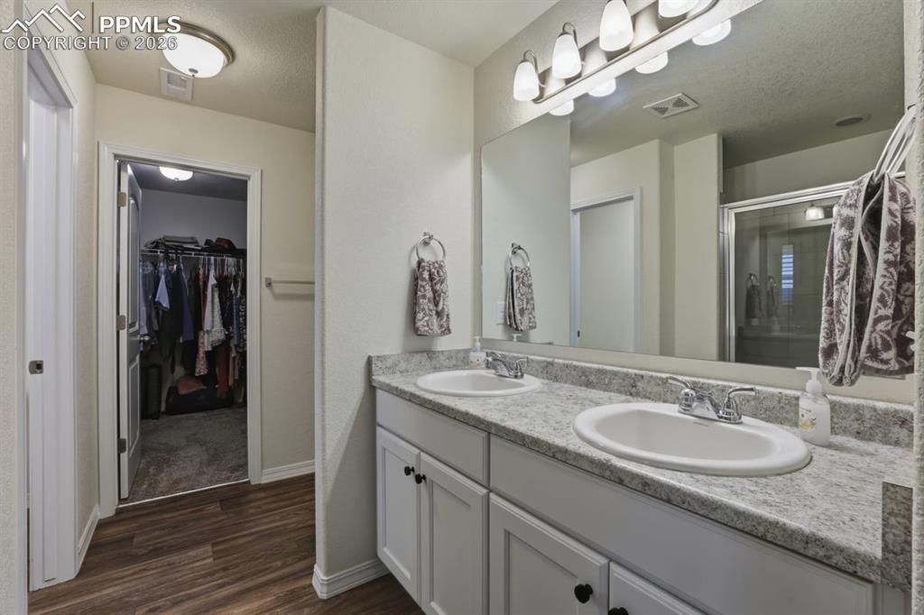 Image 23 of 38: spacious walk-in closet off of the bathroom