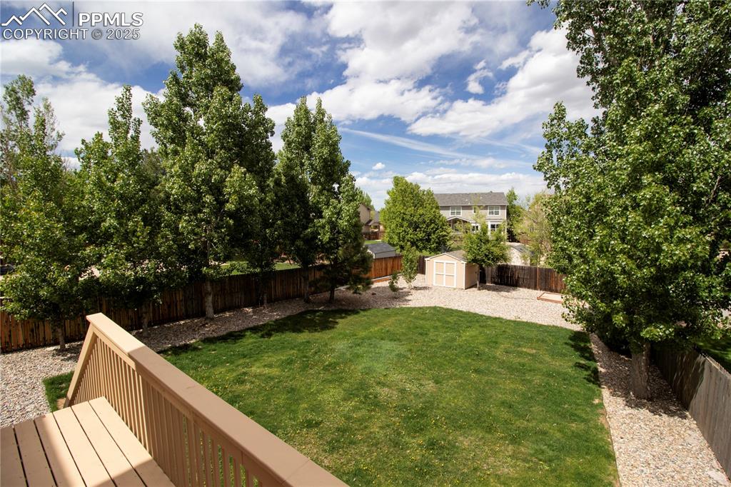 Image 46 of 48: View of yard featuring a shed, an outdoor structure, and a wooden deck