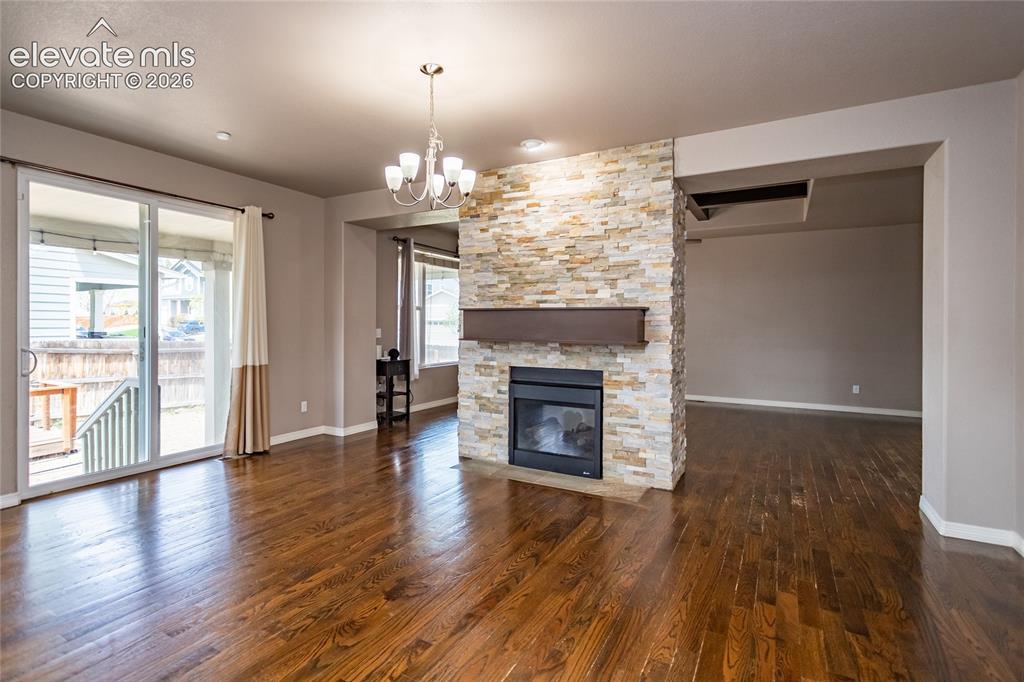 Image 10 of 45: Dining Area with double-sided fireplace