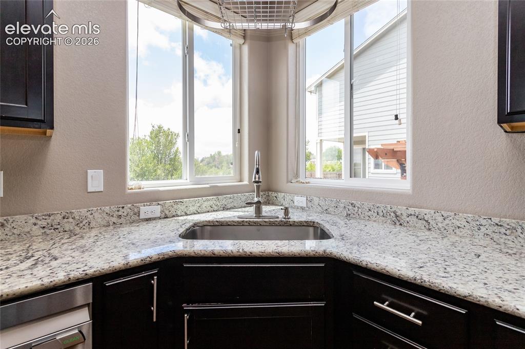 Image 13 of 45: Granite countertops and under-mounted sink