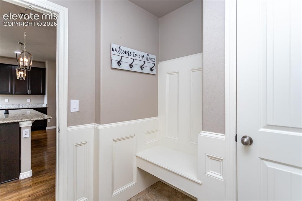 Image 19 of 45: Mud room with closet and bench