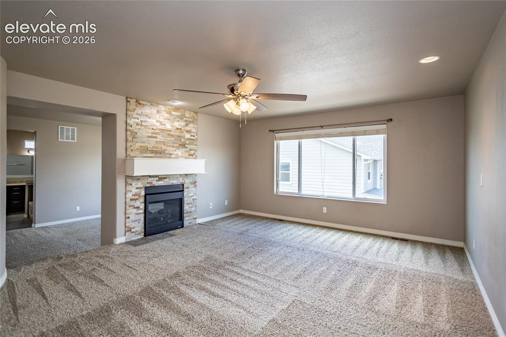 Image 25 of 45: Primary Bedroom with double-sided fireplace