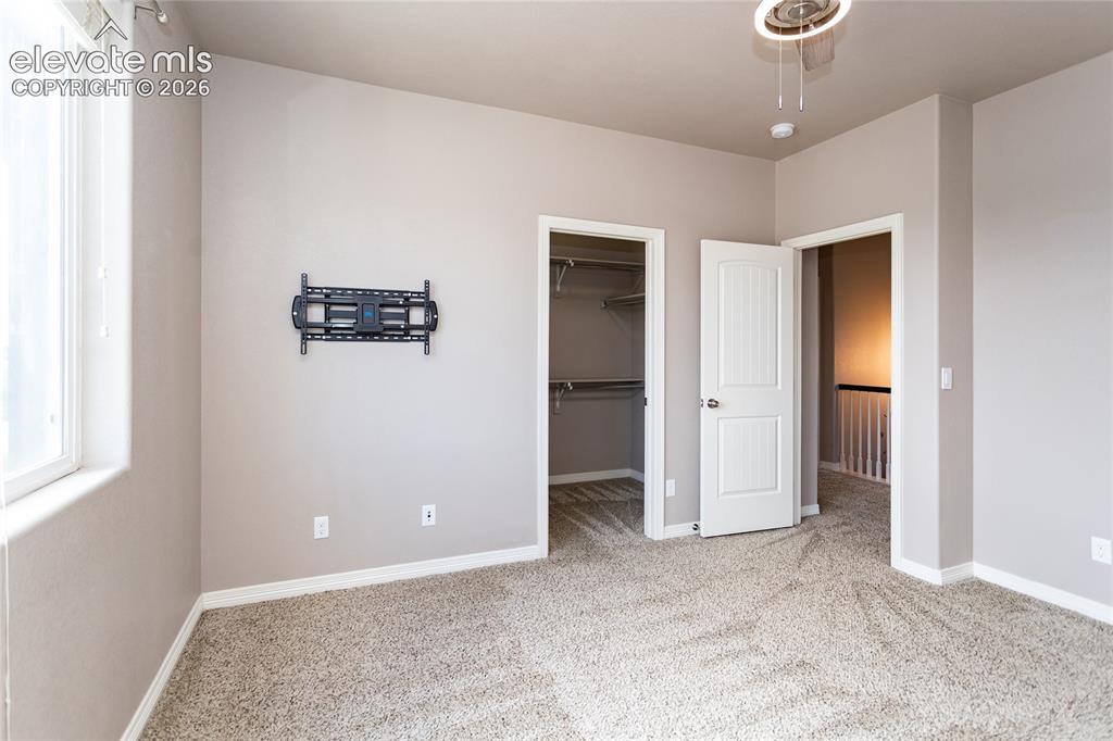 Image 32 of 45: Second Bedroom with walk-in closet