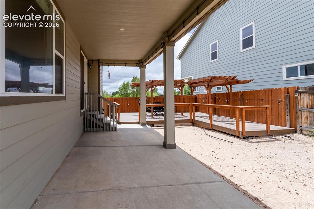 Image 40 of 45: Covered Patio right off the dining area and a detached patio with a gazebo