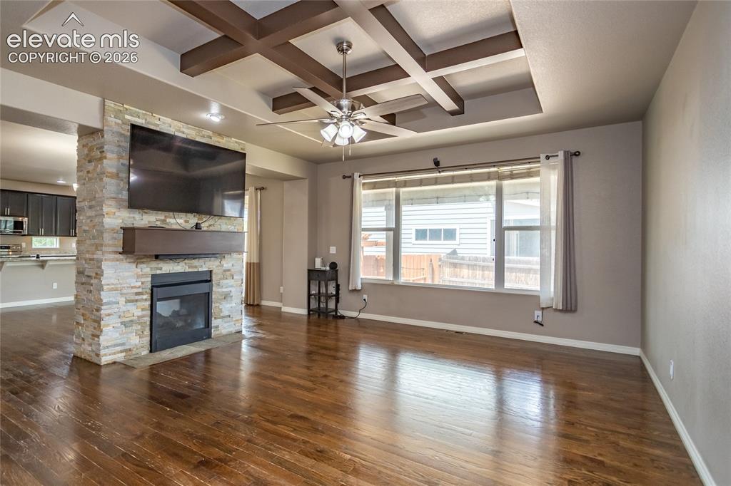 Image 7 of 45: Great Room with double-sided fireplace