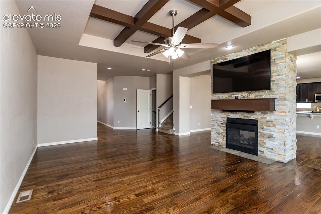 Image 8 of 45: Great Room with double-sided fireplace
