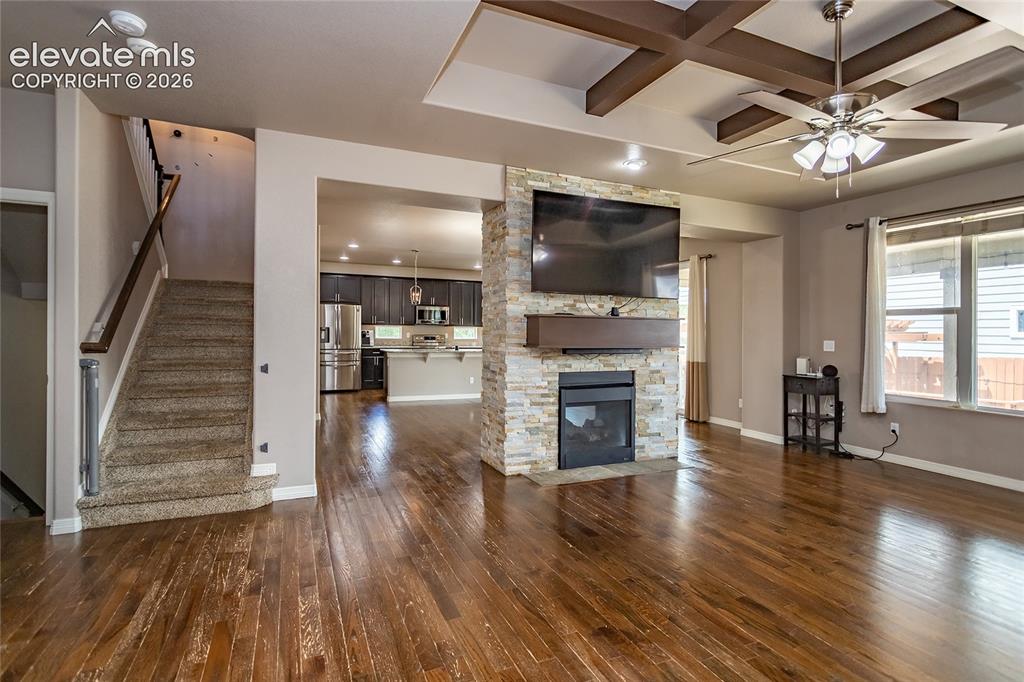 Image 9 of 45: Great Room with double-sided fireplace