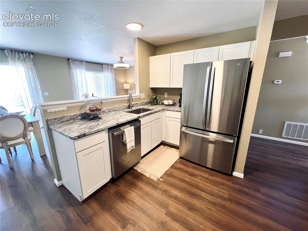 Image 6 of 29: Brand new cabinetry and quartz counters!