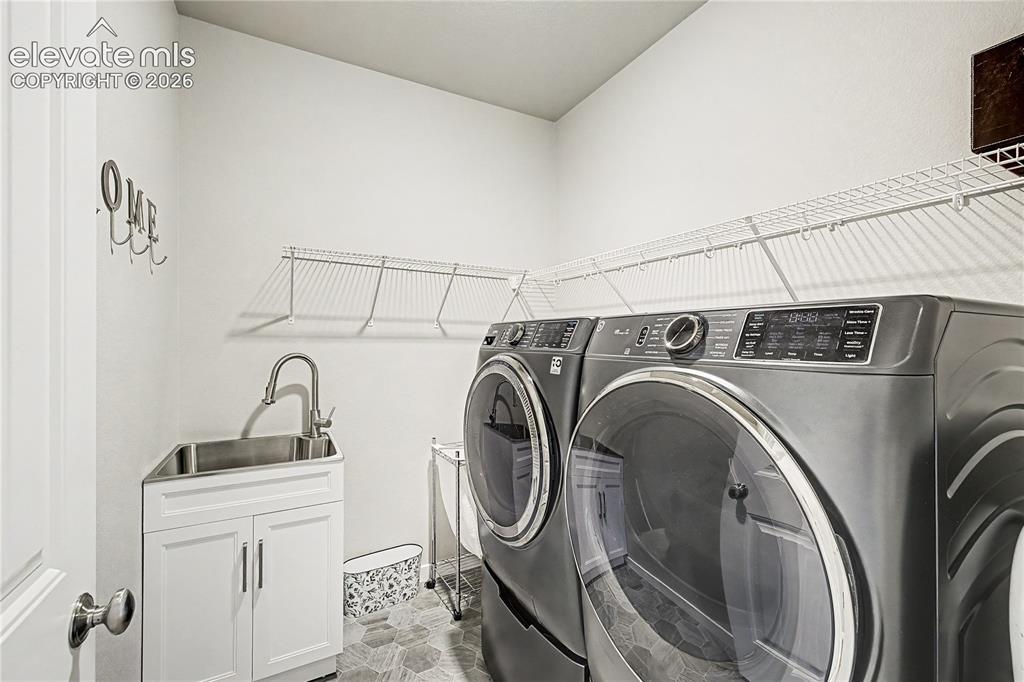 Image 11 of 46: Dedicated laundry room on the main level simplifies daily household routine