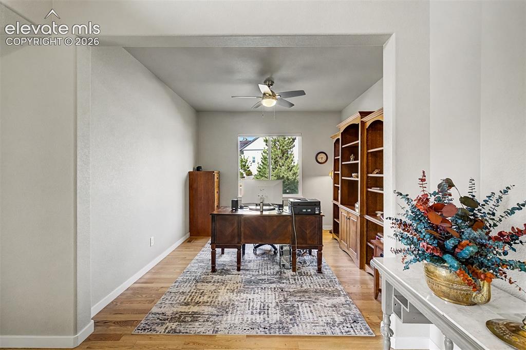 Image 9 of 46: Versatile main-level office with abundant natural light creates the perfect
