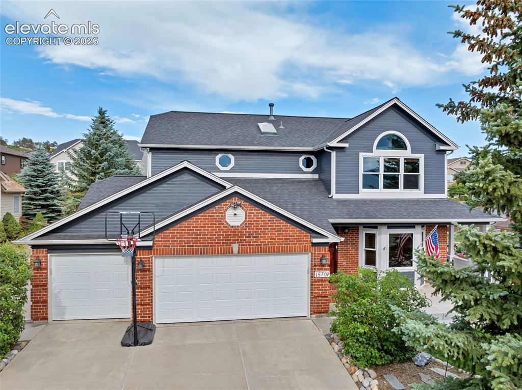 Image 1 of 47: Great curb appeal. Garage doors are new and the basketball hoop can stay wi