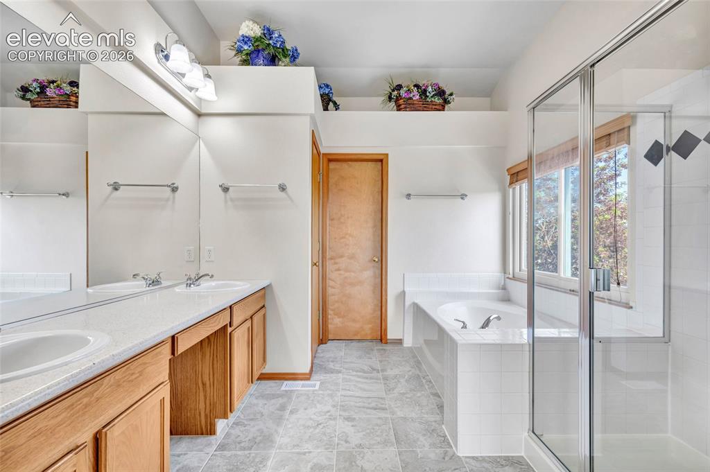 Image 17 of 47: Bathroom attached to the primary bedroom has everything you need. 