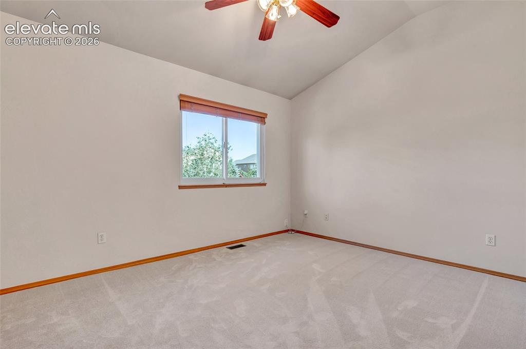 Image 22 of 47: One of the three bedrooms that are on the upper level of the house with the