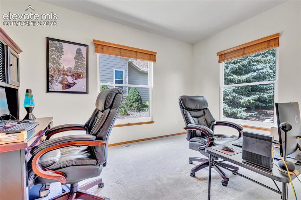 Image 29 of 47: This is the office on the main level of the house off of the family room. 