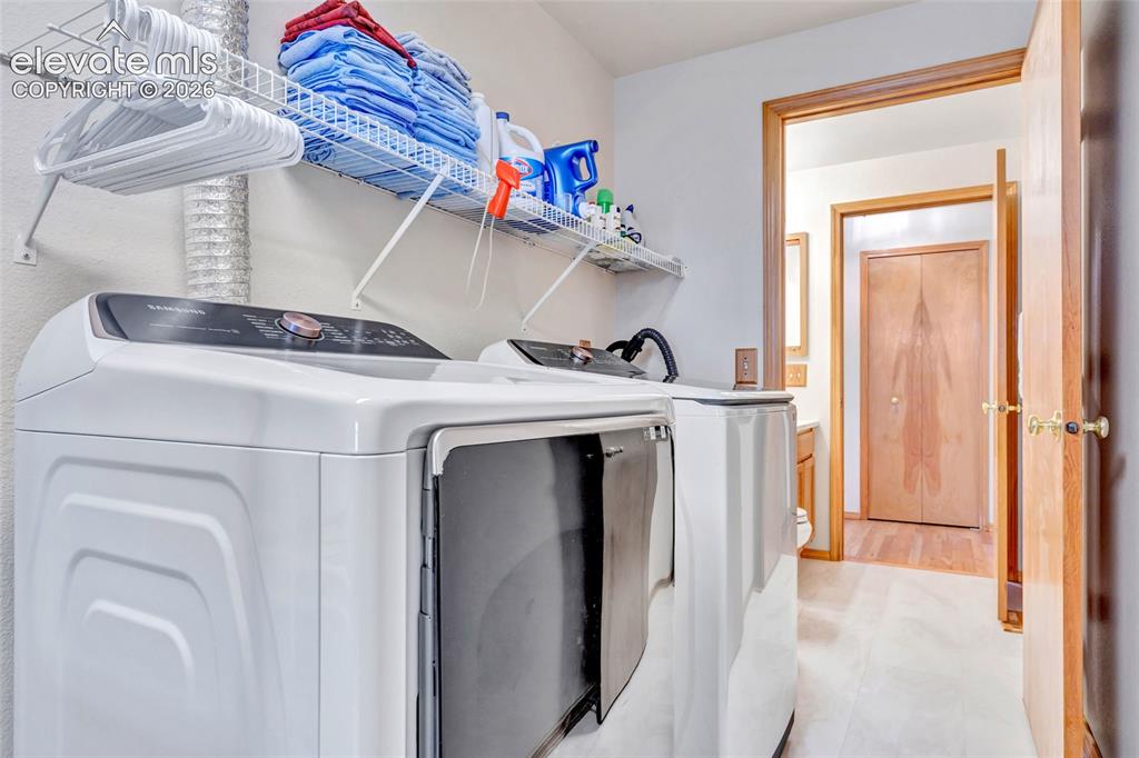 Image 32 of 47: The washer and dryer are included in the house. There is a door you can clo
