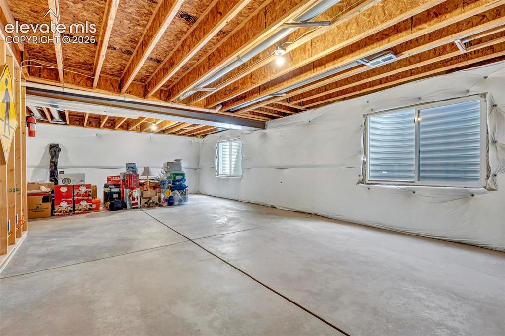 Image 33 of 47: Unfinished basement is great for storage or you could finish it and give yo