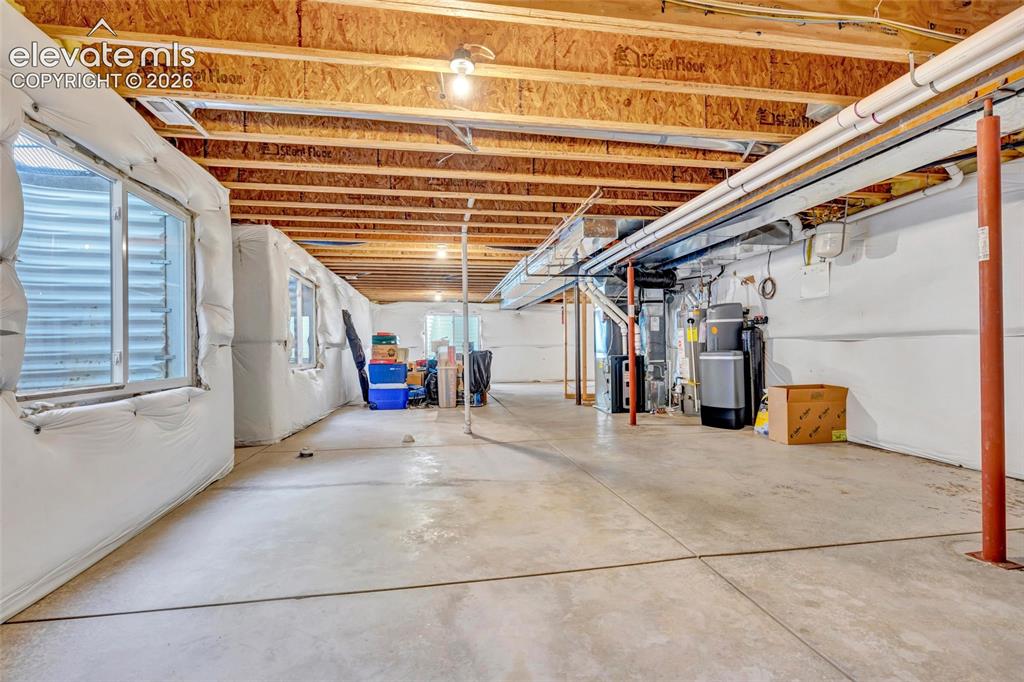 Image 34 of 47: Huge unfinished basement waiting for your inspiration. 