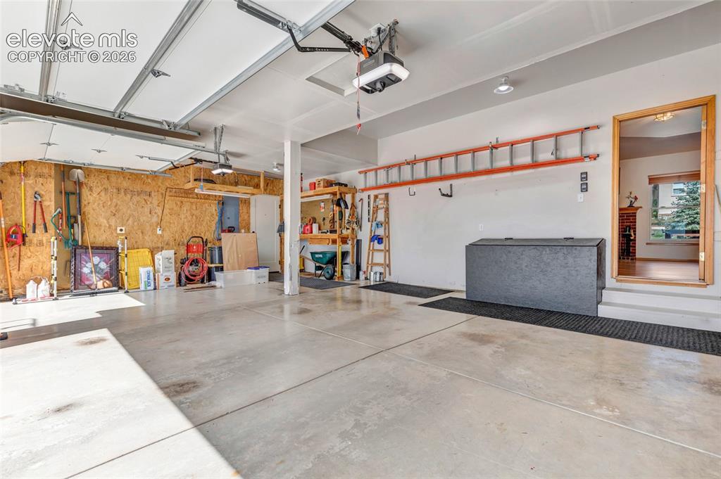 Image 35 of 47: 3 car garage with plenty of storage space The garage doors are new and the 
