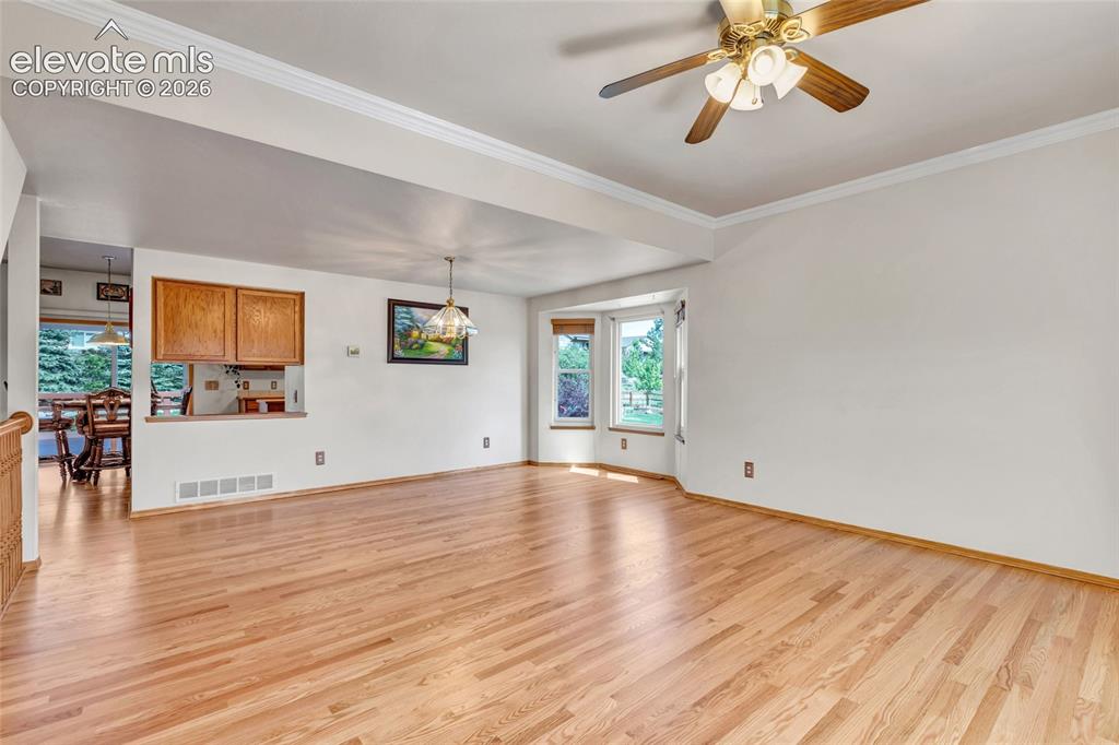 Image 6 of 47: This is a view of the living and dining room area. The dining room has anot
