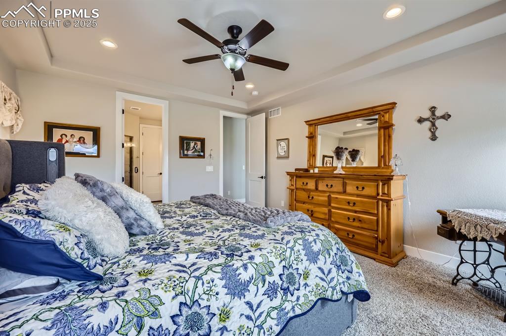 Image 12 of 27: Bedroom with carpet floors, recessed lighting, a ceiling fan, and baseboard