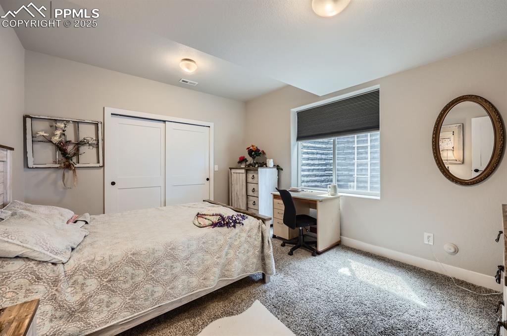 Image 20 of 27: Bedroom featuring carpet flooring, baseboards, and a closet