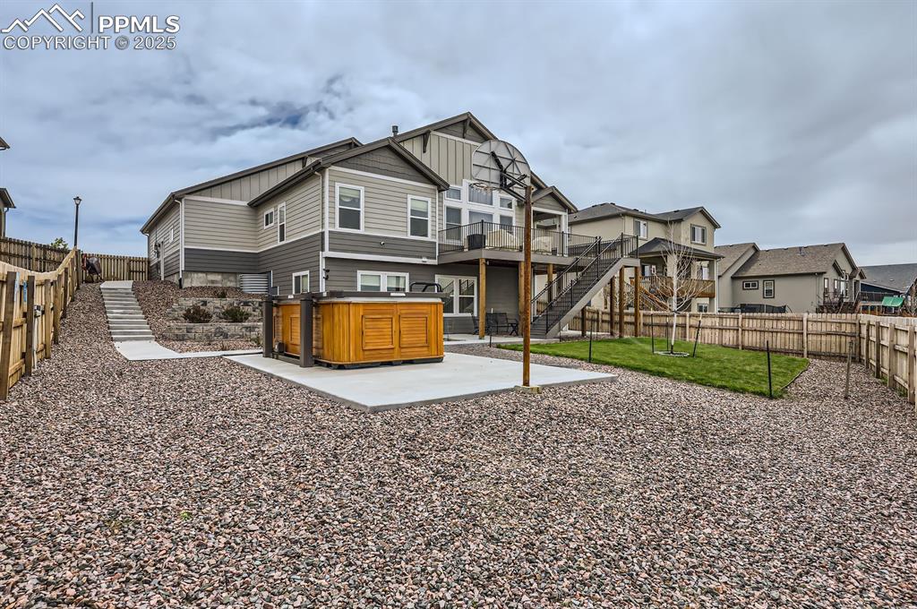 Image 26 of 27: Back of house with Basketball Court