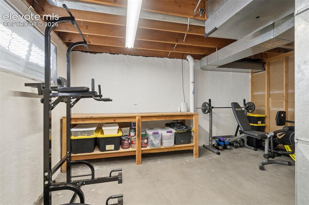 Image 36 of 49: Basement Unfinished room featuring painted masonry walls, exposed ceiling j