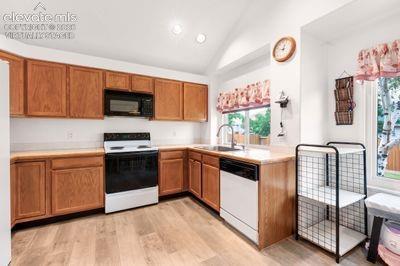 Image 13 of 49: Spacious kitchen with ample cabinet and counter space virtually staged