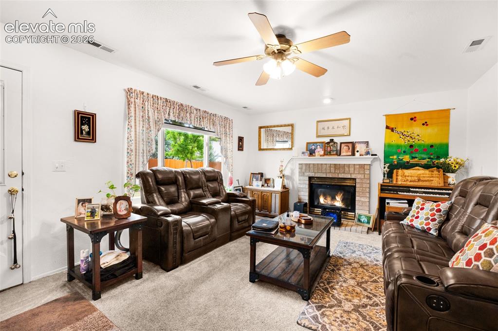Image 16 of 42: Family room with fireplace