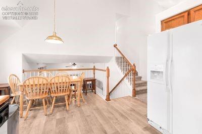 Image 17 of 49: Dining area overlooks family room. Virtually staged