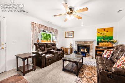 Image 19 of 49: Entertainment room with fireplace. Virtually staged