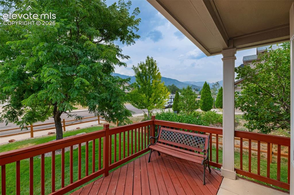 Image 8 of 42: Cozy front deck to enjoy Colorado evenings!