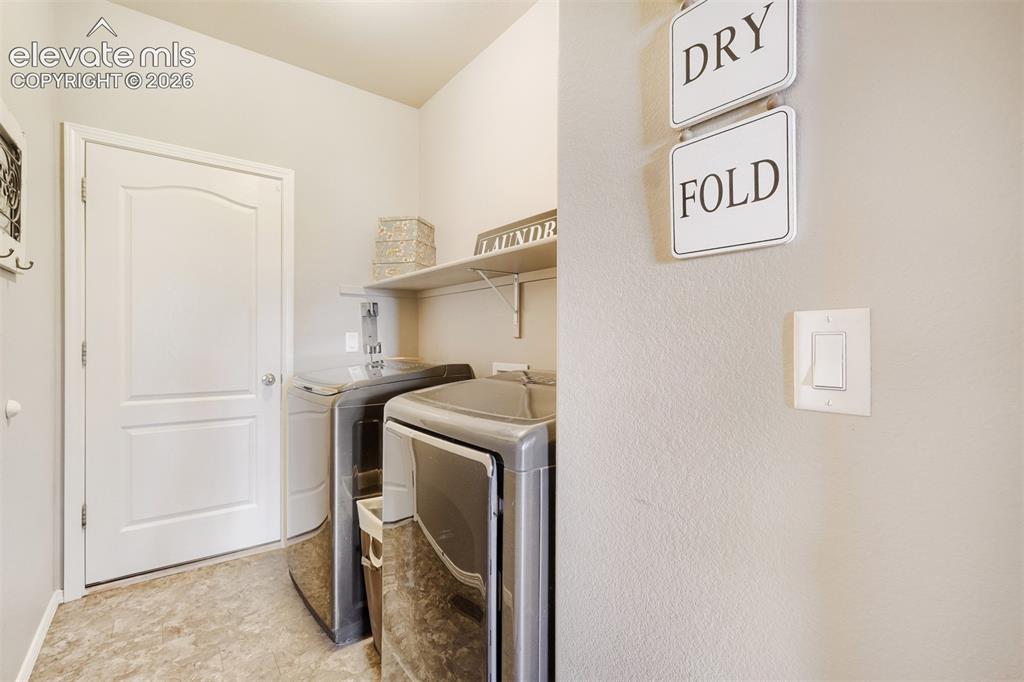 Image 17 of 31: Main level guest full bathroom featuring a dark wood-finish vanity with an