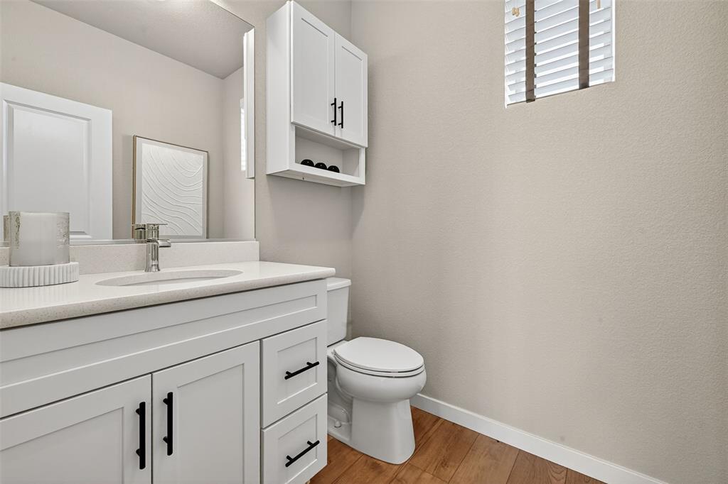 Image 13 of 32: Powder bathroom on the main floor