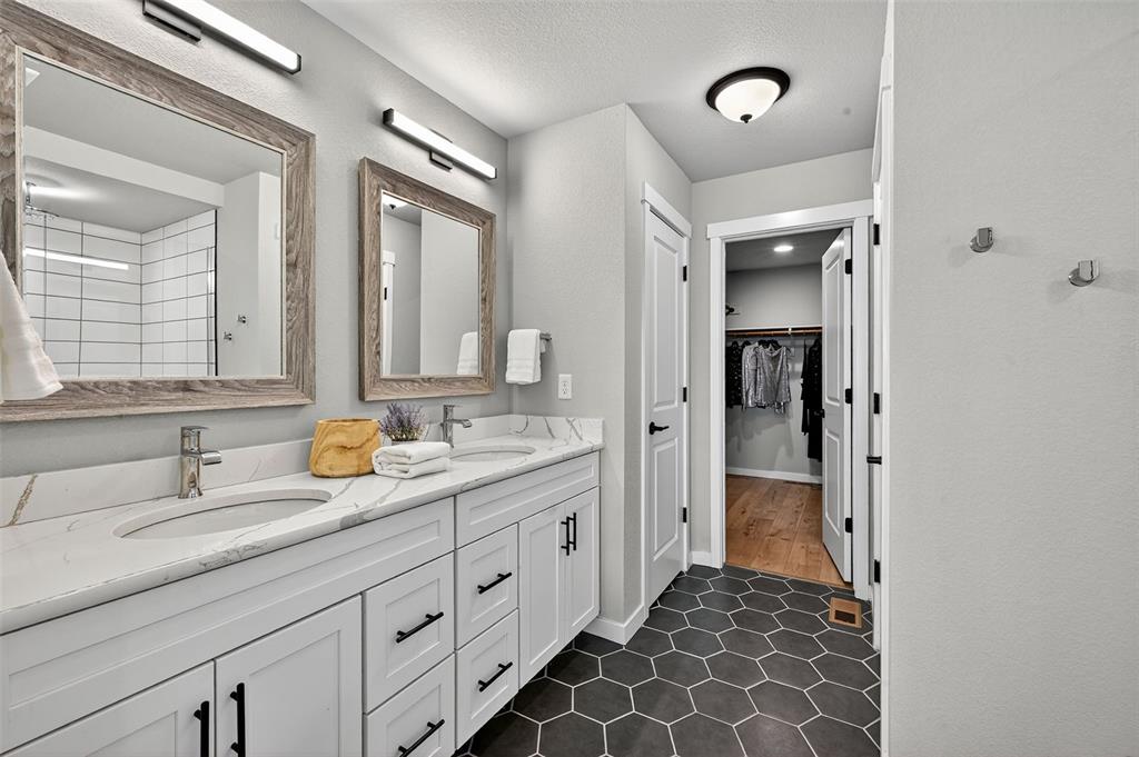Image 18 of 32: Spa like Master Bath with double vanity and walk in closet