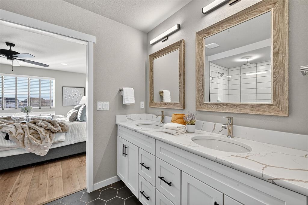 Image 19 of 32: Double vanity with quartz countertops