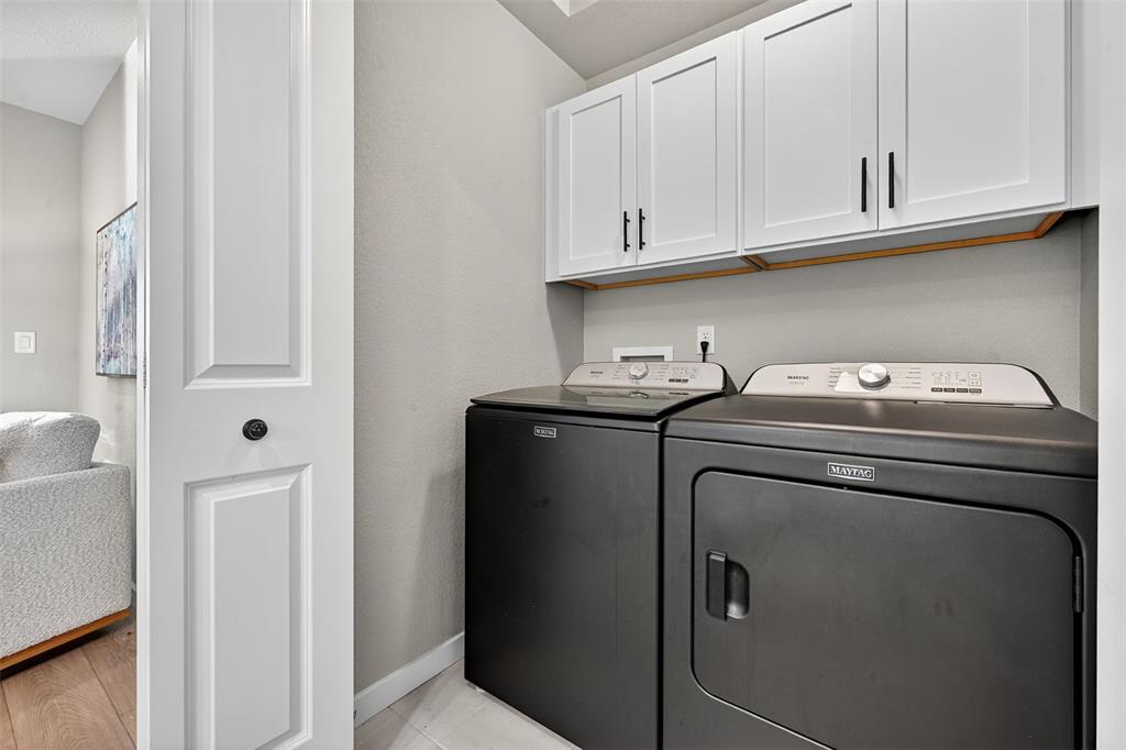 Image 22 of 32: Laundry with storage