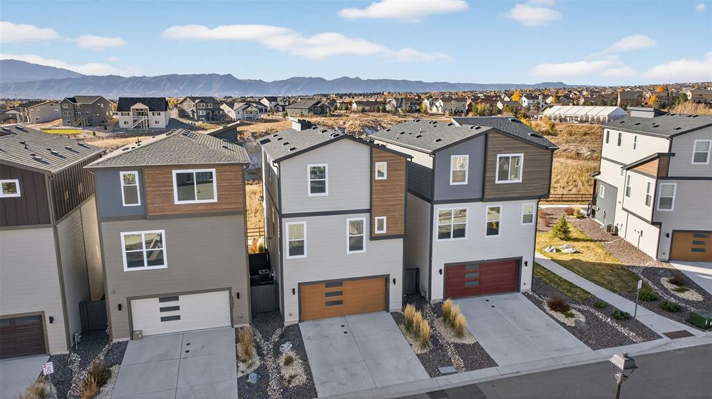 Image 26 of 32: 2 car garage with parking in driveway