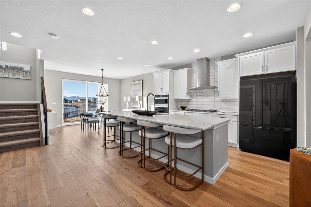 Image 4 of 32: Open floor plan from kitchen to dining room